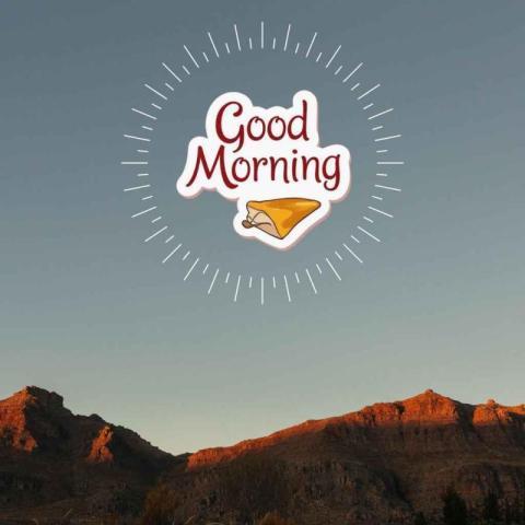 Mountain landscape during sunrise with a clear blue sky